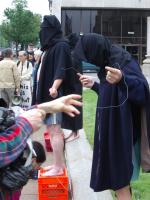 Protesters imitate Abu Ghraib torture pictures