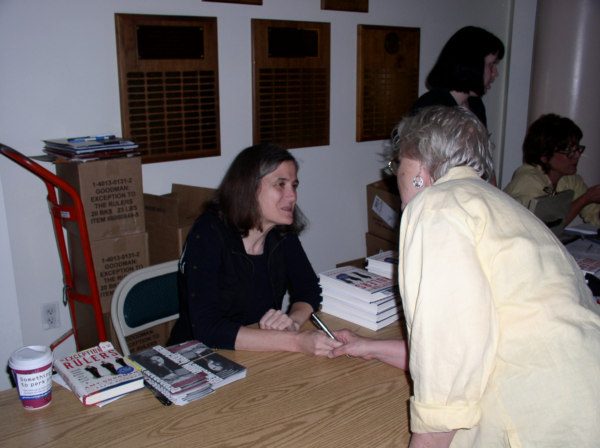 Signing a book...