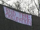 Anti-war banners greet morning commuters